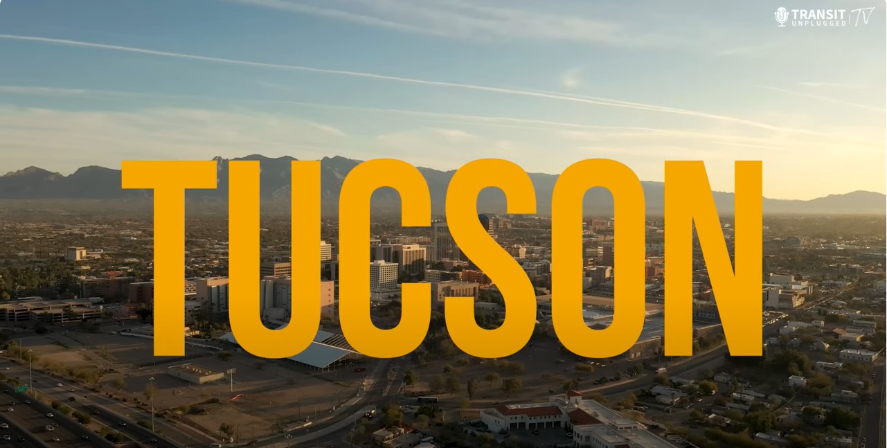 Photo of the city of Tucson with yellow lettering.