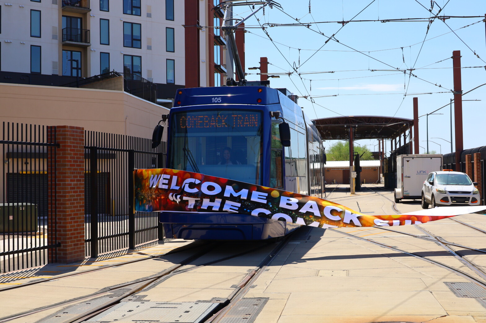 Streetcar 105 breaking through banner