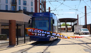 Streetcar 105 breaking through banner