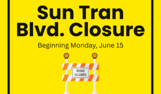 Yellow poster for Sun Tran boulevard road closure